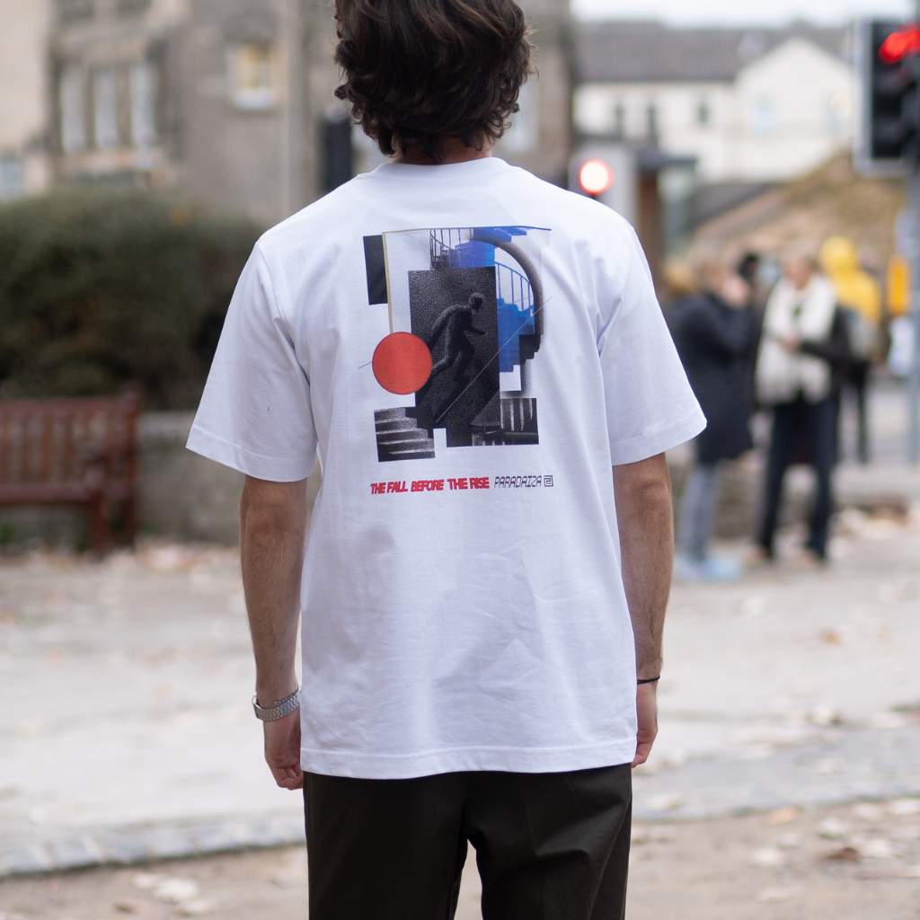 Paradaiza White t-shirt with a graphic design on the back on a model