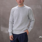 Model wearing a light grey paradaiza cashmere paradaiza knit and chinos 