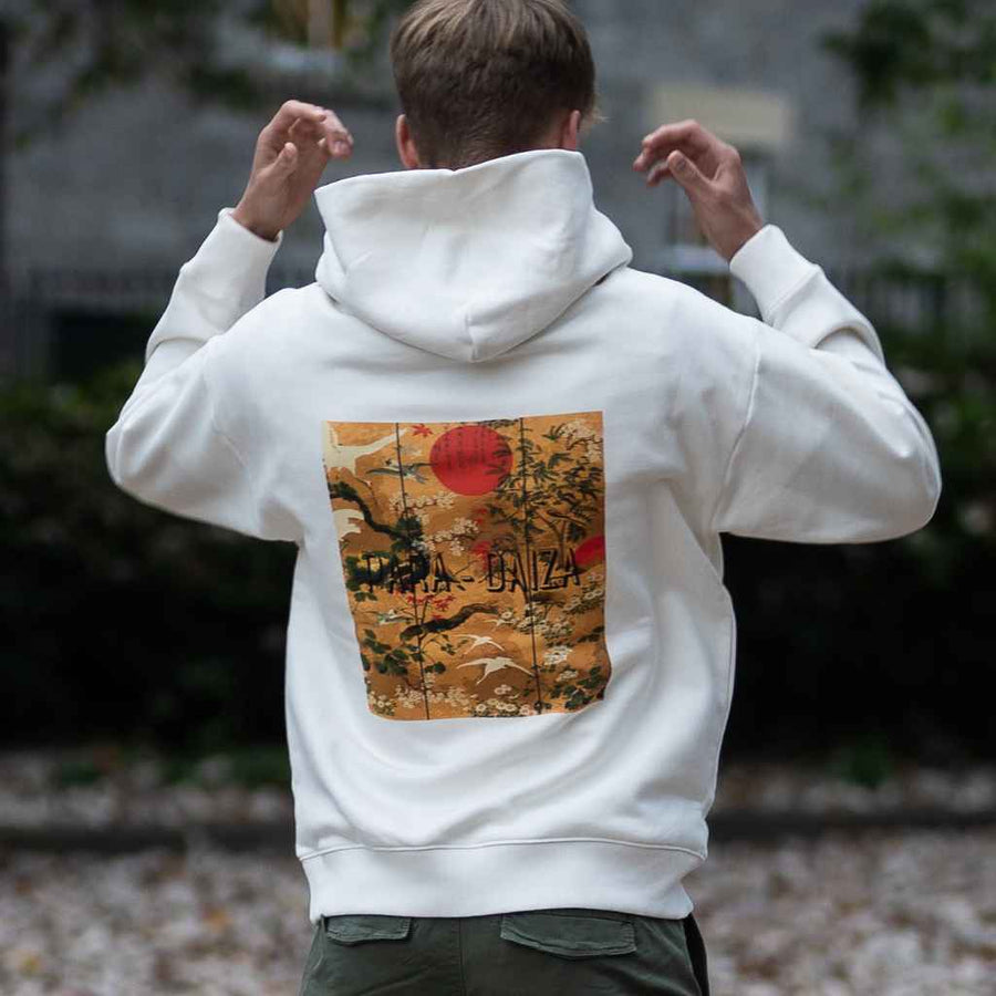 model  wears paradaiza hoody with graphic 