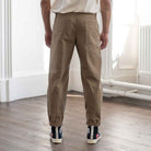 model wears para-daiza tan pinch chinos with converse