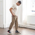 model wears para-daiza tan pinch chinos with converse