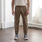 model wears para-daiza tan pinch chinos with converse