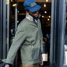 model wearing paradaiza khaki worker jacket out side the paradaiza 