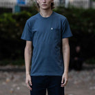 model wears paradaiza  pocket tee blue 