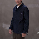 Model  wearing a dark denim paradaiza  jacket 