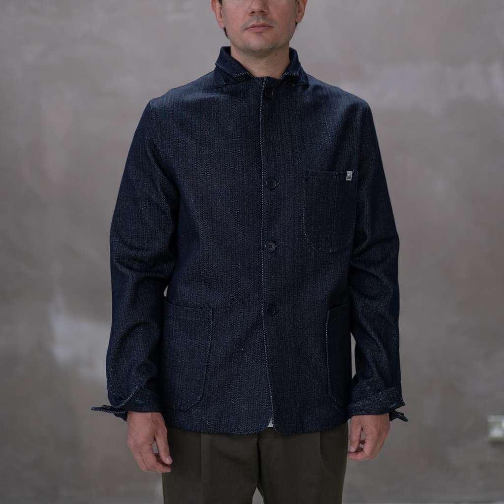 Model  wearing a dark denim paradaiza  jacket 