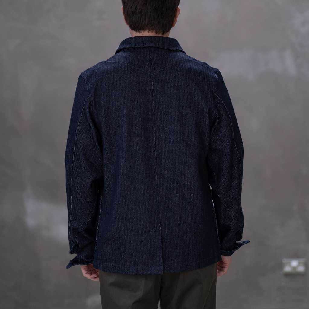 Model  wearing a dark denim paradaiza  jacket 