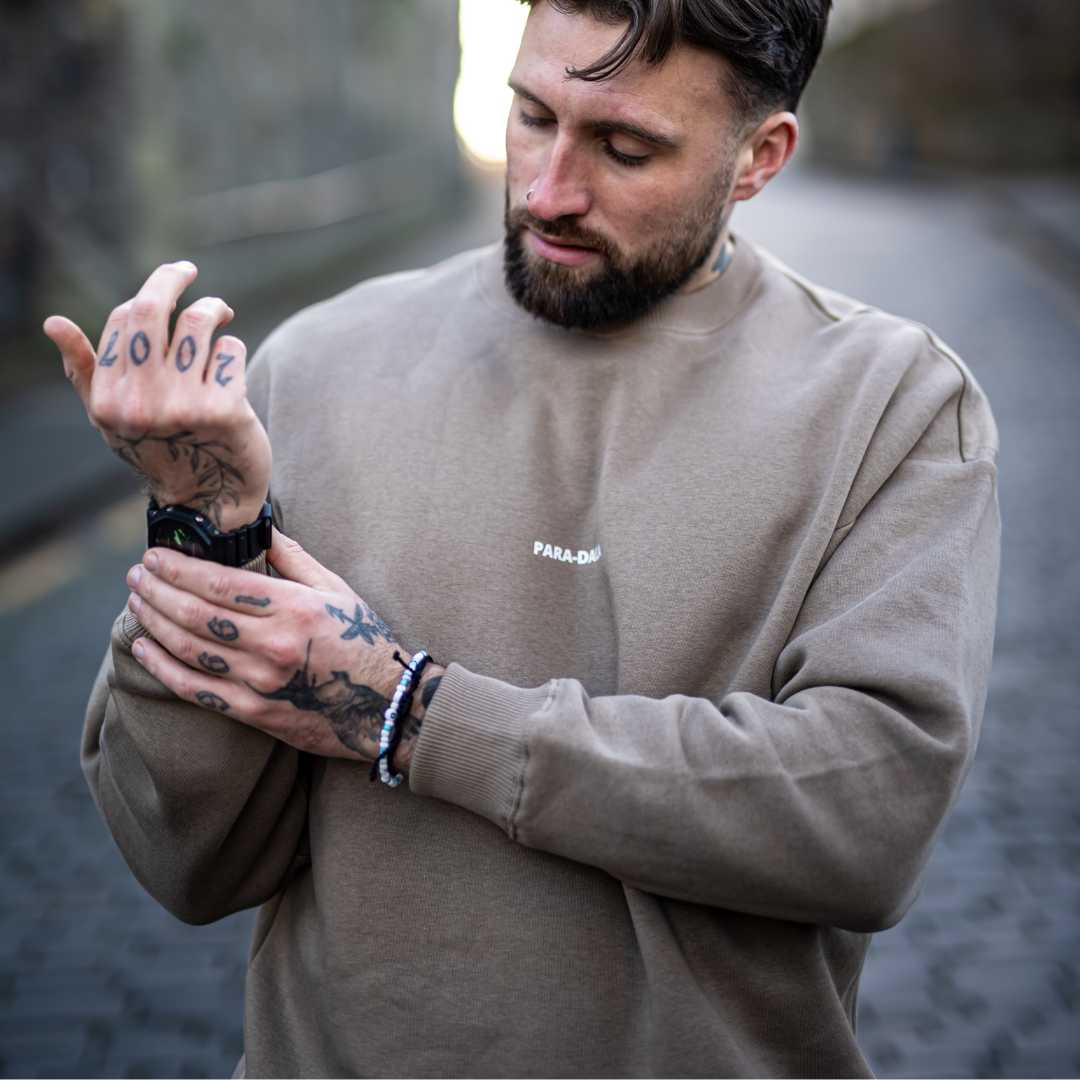 Model wears Para-Daiza Oversized Tan Crew neck sweatshirt 