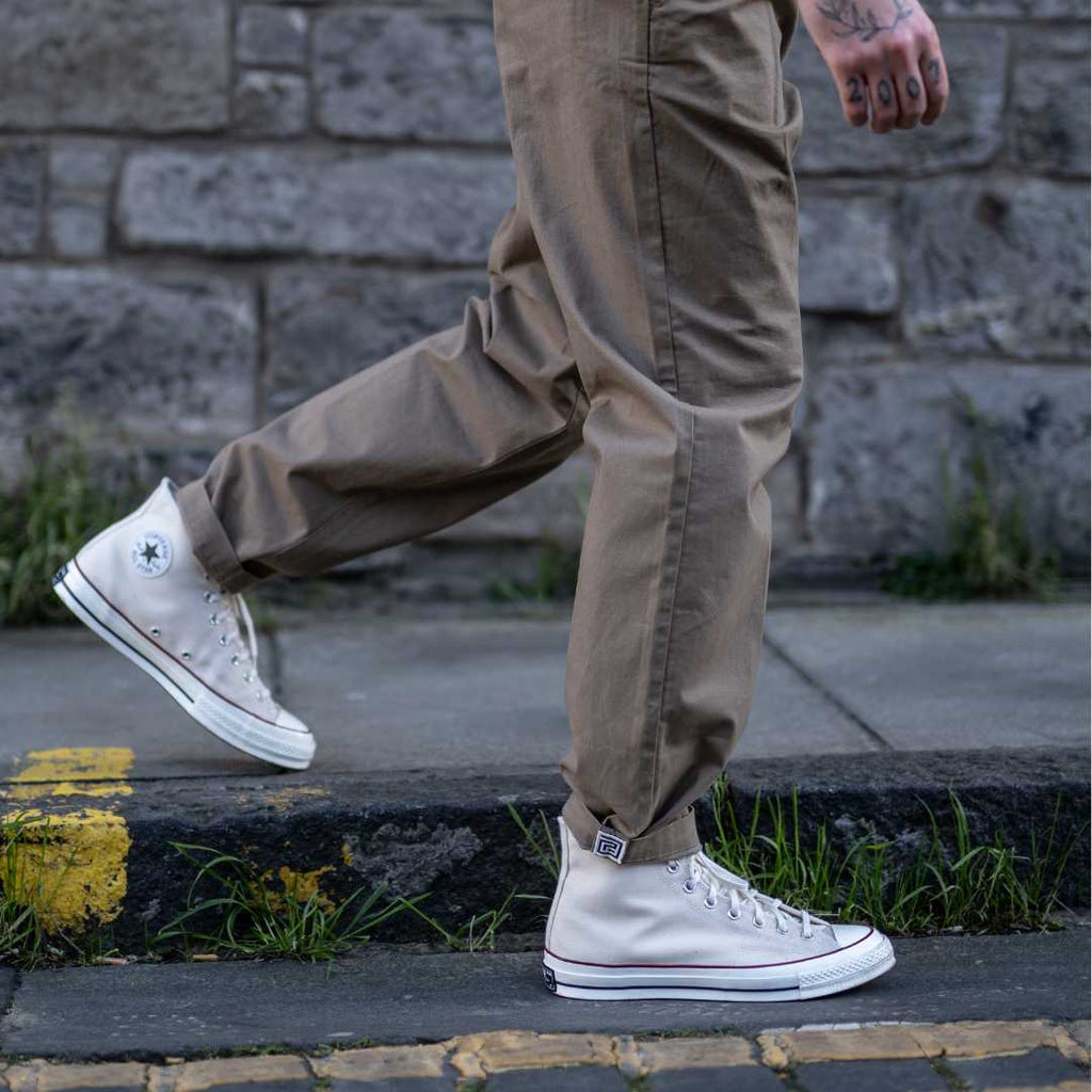 model wears para-daiza tan pinch chinos with converse