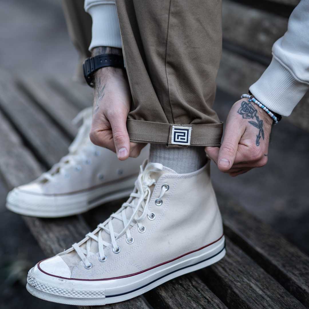 model wears para-daiza tan pinch chinos with converse